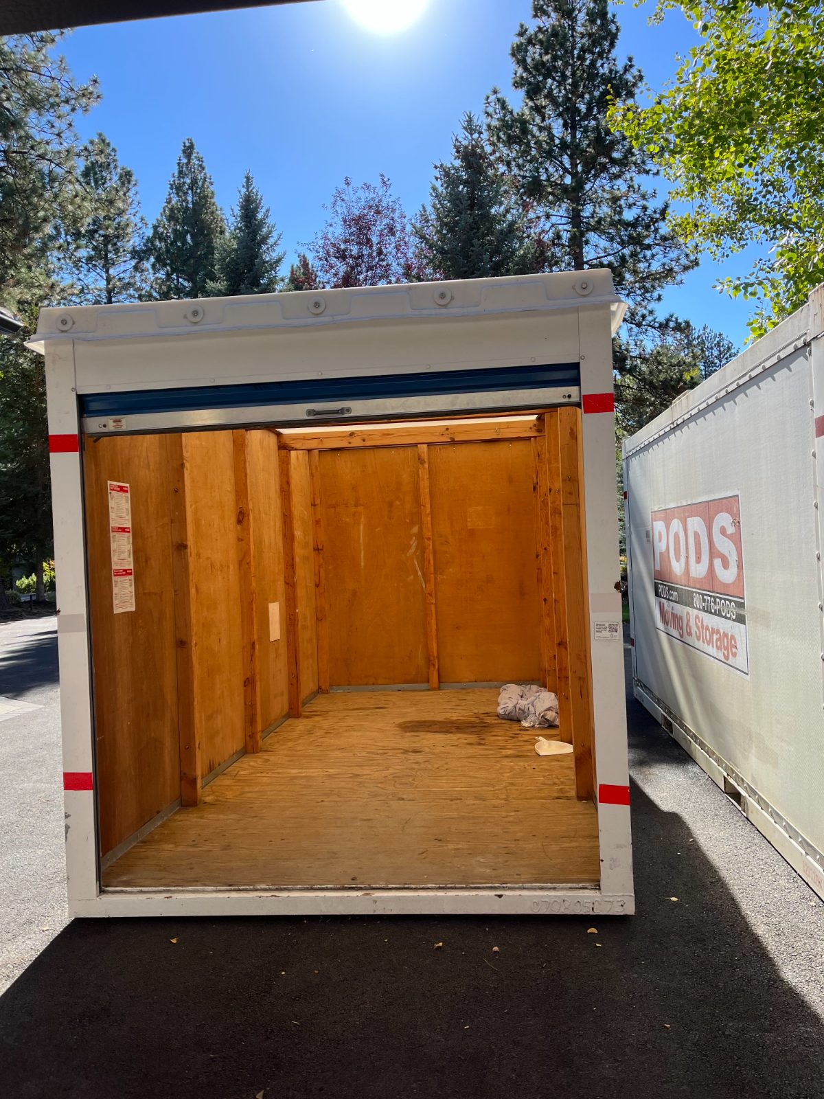 The same storage container, emptied and swept